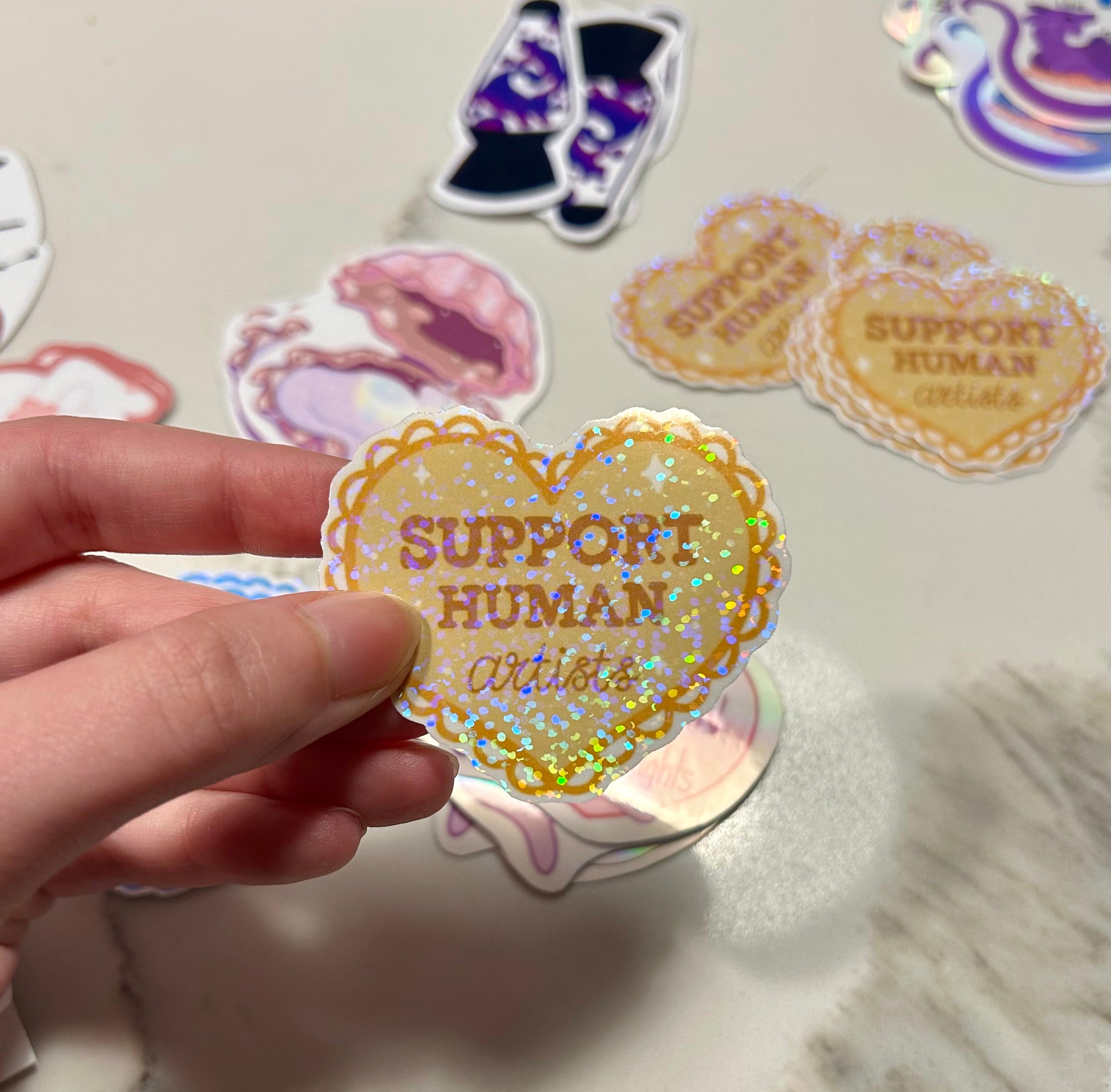 Support Human Artists 💛 Holographic Sticker